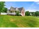 Spacious home featuring a cozy porch, well-maintained lawn, and classic architectural design, ideal for Gathering living at 71 Barrington Dr, Hiram, GA 30141