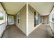 Charming front porch with stylish columns and views of the surrounding landscape, a great spot for relaxation at 71 Barrington Dr, Hiram, GA 30141