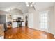 Bright kitchen features stainless steel appliances, white cabinetry, and hardwood floors at 71 Barrington Dr, Hiram, GA 30141