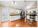 Bright kitchen features stainless steel appliances, white cabinetry, and hardwood floors at 71 Barrington Dr, Hiram, GA 30141