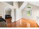 Bright kitchen features stainless steel appliances, white cabinetry, and hardwood floors at 71 Barrington Dr, Hiram, GA 30141