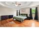 Spacious primary bedroom with large windows, hardwood floors, and tray ceilings at 71 Barrington Dr, Hiram, GA 30141