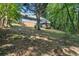 Backyard view of house with deck surrounded by a densely wooded area at 1402 Mclendon Dr, Decatur, GA 30033