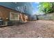View of a backyard with a brick wall and a small retaining wall at 1402 Mclendon Dr, Decatur, GA 30033
