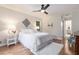 Comfortable bedroom with hardwood floors, a ceiling fan, a closet, and a serene ambiance at 1402 Mclendon Dr, Decatur, GA 30033