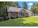 Inviting front of the home with meticulous landscaping and curb appeal at 1402 Mclendon Dr, Decatur, GA 30033