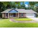 Charming home with well-manicured lawn, walkway, and an attached garage at 1402 Mclendon Dr, Decatur, GA 30033