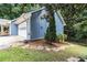 Attached two-car garage with side yard access, offering convenience and extra storage space at 1402 Mclendon Dr, Decatur, GA 30033