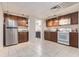 Spacious kitchen featuring stainless steel appliances, ample counter space, and wood cabinets at 1402 Mclendon Dr, Decatur, GA 30033