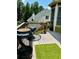 Inviting back deck includes grill and seating space perfect for outdoor entertaining and summer barbecues at 6398 Foggy Oak Dr, Fairburn, GA 30213