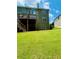 Large backyard, exterior view of home with well-maintained lawn, deck and a lush green lawn at 6398 Foggy Oak Dr, Fairburn, GA 30213