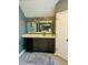 Bathroom vanity with granite countertops, a large mirror, and modern fixtures at 6398 Foggy Oak Dr, Fairburn, GA 30213