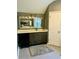 Bathroom featuring a dark vanity, large mirror, and modern fixtures at 6398 Foggy Oak Dr, Fairburn, GA 30213