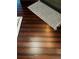 Close-up of dark hardwood flooring with an area rug showcasing the floor's rich tones at 6398 Foggy Oak Dr, Fairburn, GA 30213