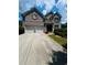 Charming two-story brick home with a two-car garage and well-maintained front yard at 6398 Foggy Oak Dr, Fairburn, GA 30213