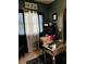 Cozy home office featuring a mirrored desk, comfortable chair, and window with natural light at 6398 Foggy Oak Dr, Fairburn, GA 30213