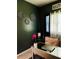 Stylish home office with dark walls, decorative art, and a comfortable workspace at 6398 Foggy Oak Dr, Fairburn, GA 30213