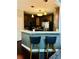 Stylish kitchen with modern appliances, a breakfast bar, and pendant lighting at 6398 Foggy Oak Dr, Fairburn, GA 30213