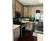Well-lit kitchen features stainless steel appliances, including a microwave and refrigerator at 6398 Foggy Oak Dr, Fairburn, GA 30213