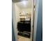Convenient laundry room features newer washer and dryer, plus shelving for storage at 6398 Foggy Oak Dr, Fairburn, GA 30213