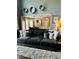 Cozy living room featuring comfortable seating and views into the dining area at 6398 Foggy Oak Dr, Fairburn, GA 30213
