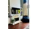 Inviting living room with a fireplace, built-in shelving, and plush seating at 6398 Foggy Oak Dr, Fairburn, GA 30213
