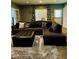 Comfortable living room features a sectional couch and soft decor at 6398 Foggy Oak Dr, Fairburn, GA 30213