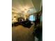 Spacious main bedroom boasts decorative lighting, a seating area, and ample closet space at 6398 Foggy Oak Dr, Fairburn, GA 30213