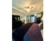 Bright main bedroom features a tray ceiling and elegant decor at 6398 Foggy Oak Dr, Fairburn, GA 30213
