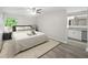 Bright bedroom with hardwood floors, ceiling fan, large window, and attached bathroom at 12 Dunwoody Springs Dr # 12, Atlanta, GA 30328