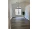 Dining room with new vinyl floors, wainscotting, a chandelier, and fresh paint at 1570 Jami Hollow Way, Lawrenceville, GA 30043