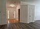 Foyer featuring tile and hardwood-style flooring offering a welcoming entrance to the home at 1570 Jami Hollow Way, Lawrenceville, GA 30043
