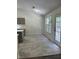 Bright kitchen with modern cabinets, new floors, white countertops, and access to the exterior at 1570 Jami Hollow Way, Lawrenceville, GA 30043