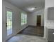 Bright sunroom with large windows, hardwood-style flooring, and ample natural light at 1570 Jami Hollow Way, Lawrenceville, GA 30043