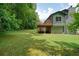A lush green backyard, complete with a deck, perfect for outdoor activities and relaxation at 174 Village Dr, Hiram, GA 30141