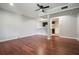 Finished basement with hardwood floors, a ceiling fan, neutral walls, and a wet bar area at 174 Village Dr, Hiram, GA 30141