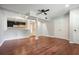 Spacious finished basement with hardwood floors, a ceiling fan, neutral walls, and a wet bar area at 174 Village Dr, Hiram, GA 30141