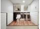 Charming bathroom features wood-look flooring, a pedestal sink, and modern fixtures at 174 Village Dr, Hiram, GA 30141