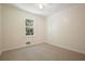 Cozy bedroom featuring wall-to-wall carpet and a large window at 174 Village Dr, Hiram, GA 30141