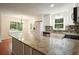 Kitchen with stainless steel appliances, stone countertops, tile backsplash, and white cabinetry at 174 Village Dr, Hiram, GA 30141