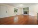 Inviting living room with beautiful hardwood floors, a cozy stone fireplace, and lots of natural light at 174 Village Dr, Hiram, GA 30141