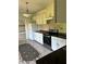 Functional kitchen featuring white cabinets, dark countertops, and stainless steel appliances at 3306 Chastain Ridge Dr, Marietta, GA 30066