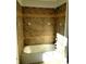 Bathroom shower featuring brown tiled walls and a tiled accent border at 3306 Chastain Ridge Dr, Marietta, GA 30066