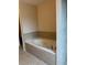 Jetted tub with neutral tile surround at 3457 Dacite Ct, South Fulton, GA 30349