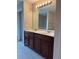 Bathroom featuring double vanity with cabinets, tile floor and a large mirror at 3457 Dacite Ct, South Fulton, GA 30349