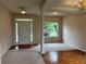 Inviting entryway featuring a bright interior, with hardwood floors and neutral carpeting at 3457 Dacite Ct, South Fulton, GA 30349