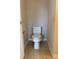 Simple powder room with a standard toilet and tile flooring in a neutral color at 3457 Dacite Ct, South Fulton, GA 30349