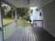 A gray back porch shows the backyard and a view of a shed at 4187 Alaina Cir, Austell, GA 30106