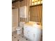 This is a bathroom with a vanity, toilet, and a shower-tub combination with a white tiled surround at 4187 Alaina Cir, Austell, GA 30106