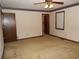 Bedroom with neutral carpet, ceiling fan, window with blinds, and a door to another room at 4187 Alaina Cir, Austell, GA 30106